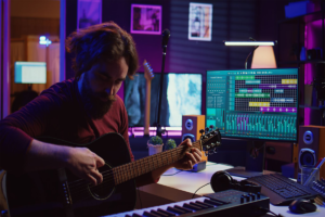 Skilled musician teaching how to play acoustic guitar_images-1200x800